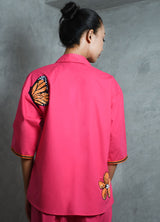 Hot pink cotton shirt with hot pink straight pants.